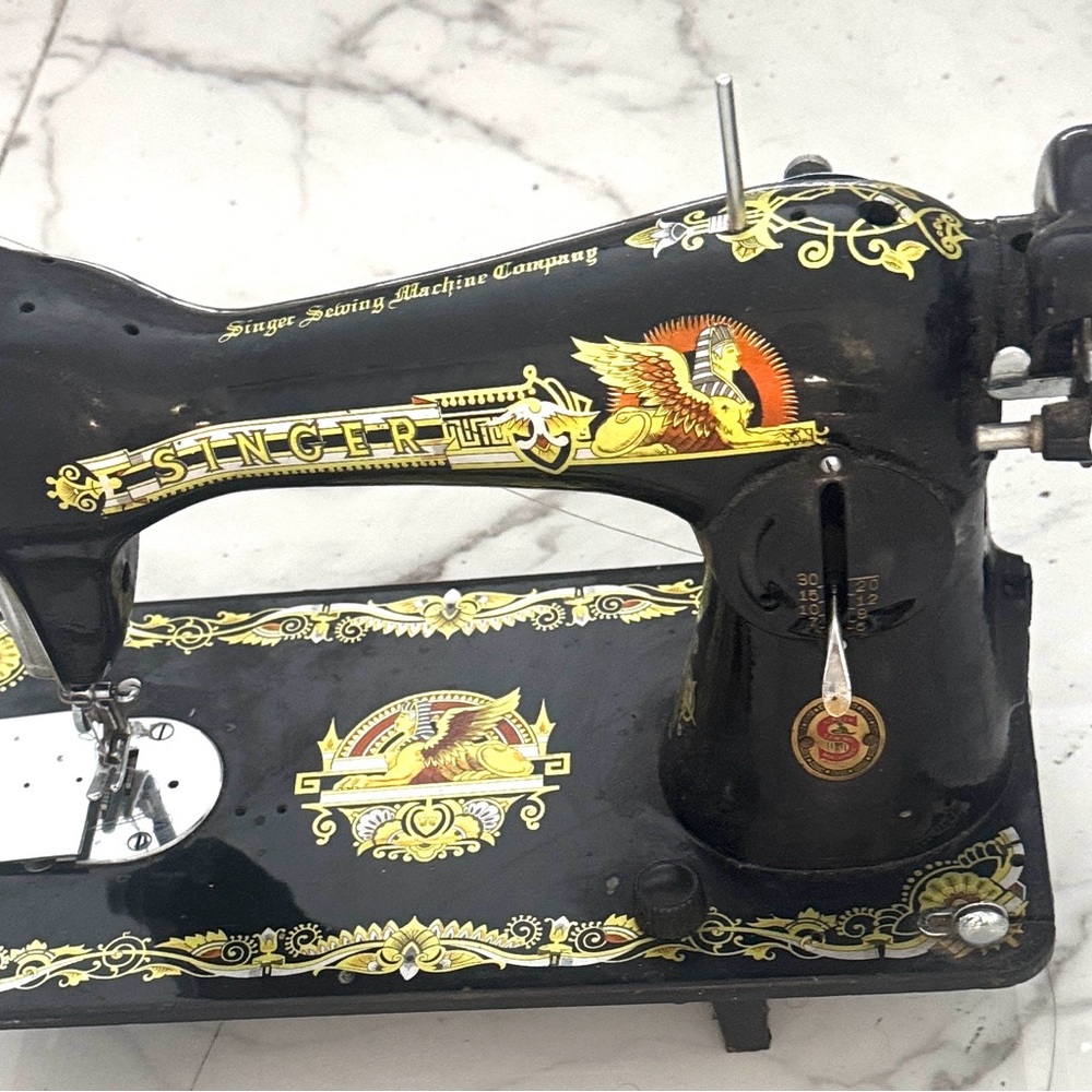 Collectible Vintage Sewing Machine with Black and Gold Design